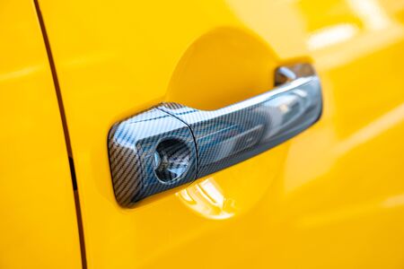 Car Door Lock and Handle. Yellow color. Transportation.の写真素材