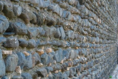 Texture of old rock wall for background, Medieval stone wall. Building.の写真素材
