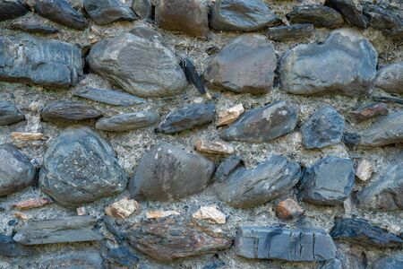 Texture of old rock wall for background, Medieval stone wall. Building.の写真素材
