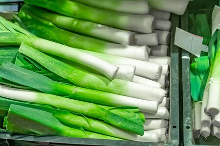 Bunch of fresh organic leek on the shelve inÂ a market. Vegetableの写真素材