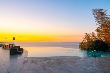 Infinity Edge Swimming Pool Water, Beautiful Black Sea View at sunset. Relaxation.の写真素材