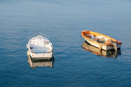 Two little fishing boats floating on the Mediterranean sea shore. Italy. Seascape. の写真素材