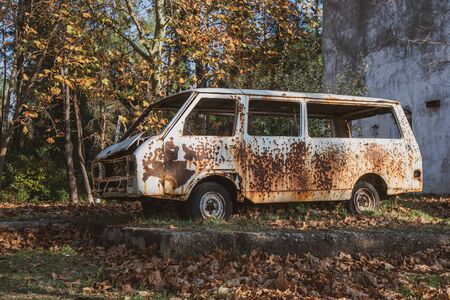Old abandoned rusty car in a park. Vintage.の写真素材