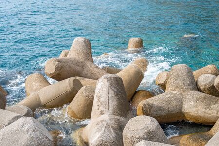 Breakwater of concrete tetrapods in Amalfi coastal town. Mediterranean Sea.の写真素材