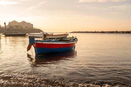 Fishing boats floating on the Mediterranean sea shore. Italy. Seascape. の写真素材
