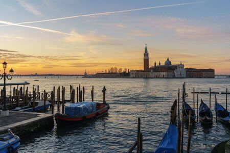 Sunrise at Venice with gondola and islandの写真素材