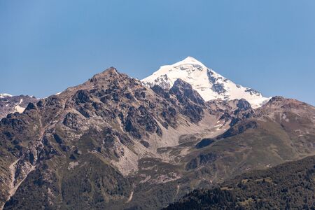 Mount Tetnuldi rises above the Great Caucasian Range in the upper Svaneti in Georgia, Mountain Landscape. Travel.の写真素材