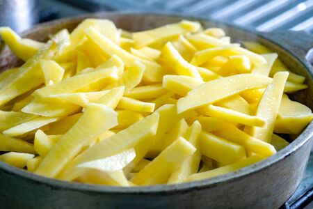 Potatoes at home in a frying pan. Food.の写真素材