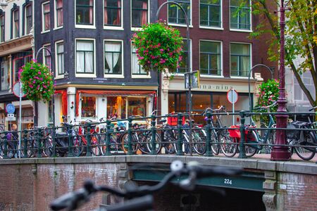 Eindhoven, Netherlands - 16.10.2019 Amsterdam canal with bicycles on bridge. Travelのeditorial素材