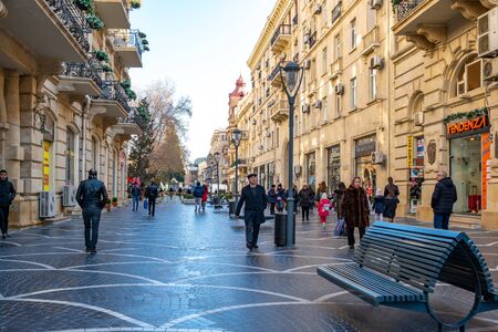 Baku, Azerbaijan 27 January 2020 - People traveling in the streets of Baku. Cityscape.のeditorial素材