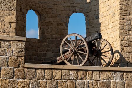 Cast iron cannon in the tower of Icheri Sheher fortress, battlemented fortress wall of the old city of Bakuの写真素材