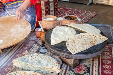 Woman making Azerbaijan Qutab with Greens. Traditional food.の写真素材