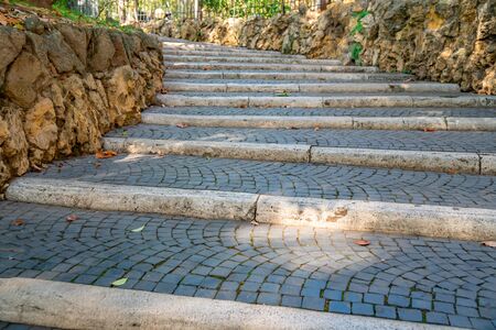 Weathered stone stairs with a fallen fall leaves, Rome, Italy.