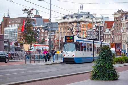 Amsterdam, Netherlands - October 14, 2019: Tram driving in Amsterdam city center. Travelのeditorial素材