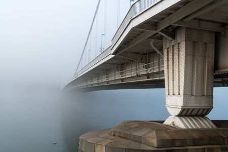 Elisabeth Bridge on foggy morning in Budapest, connecting Buda and Pest across the River Danube....