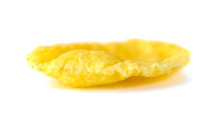 Single cornflake isolated on a white background, dry cereal, breackfast