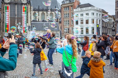 Amsterdam, Netherlands - October 14, 2019: Many people in front of Royal Palace Amsterdam and Dam Squareのeditorial素材