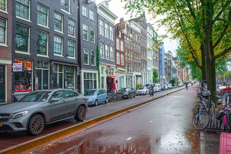 Amsterdam, Netherlands - October 15, 2019: Typical colorful buildings in Amsterdam, travelのeditorial素材