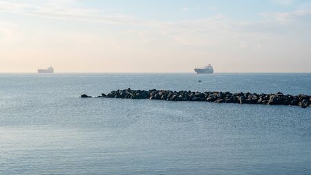 Oil tanker ship at blue sea, Naples, Italyの写真素材
