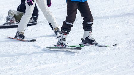 Young man on skis out of slopes, Equipment and extreme winter sports at place for skiingの写真素材