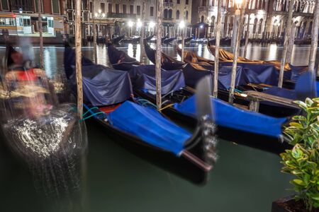 Grand Canal with gondolas at night, Venice, Italy. It is one of the main tourist attractions of Veniceの写真素材