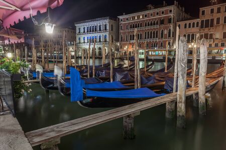 Grand Canal with gondolas at night, Venice, Italy. It is one of the main tourist attractions of Veniceの写真素材