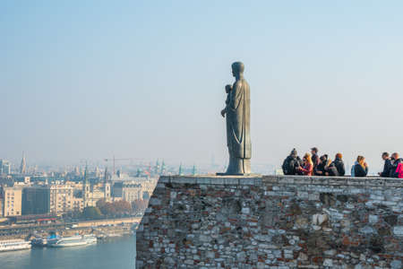 Budapest, Hungary - November 11, 2018: Virgin Mary Statue from the left side with overview of Budapest city in the backgroundのeditorial素材