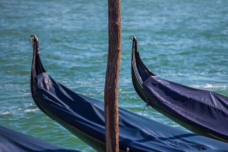 Traditional Gondolas floating on Grand Canal in Venice, Italyの写真素材