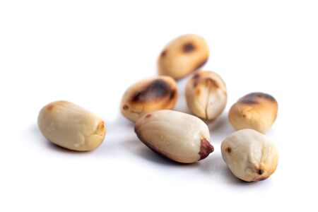 Roasted at home peanuts isolated on white background, foodの写真素材