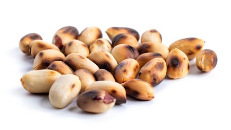 Roasted at home peanuts isolated on white background, food