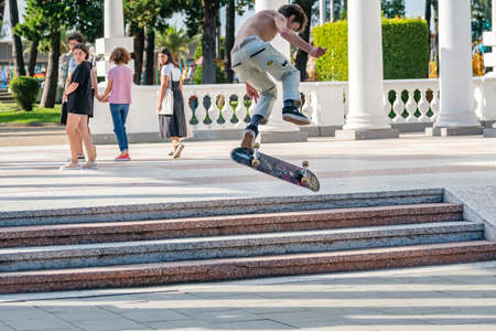 Batumi, Georgia - 04 August, 2020: Young skateboarder in Batumi park. Travel