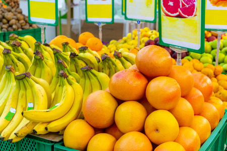 Bananas and oranges in the supermarket, fresh fruitsの写真素材