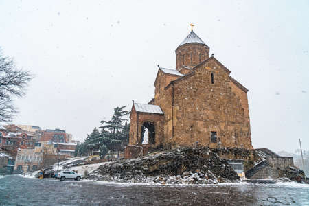 Virgin Mary Metekhi church wiht covered snow. Winter