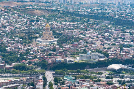 Panoramic view of Tbilisi with Sameba, Trinity Church and other landmarks. Cityscape