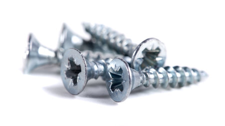 Chrome screw on white background. Self-tapping screws from steel close-upの写真素材