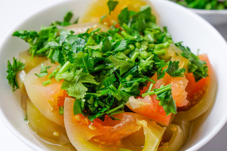 Salted tomato with chopped parsley, healty homemade foodの写真素材
