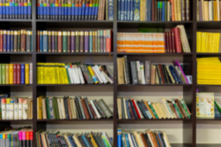 Various types of books on a library shelf. Education