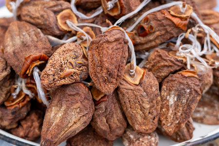 Dried persimmon fruits are sold at the market. Healthy fruitsの写真素材