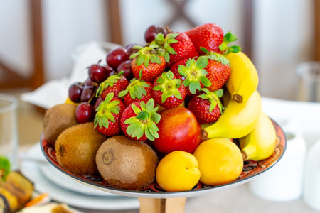Raw fruits berries assortment platter on the plate, fresh foodの写真素材