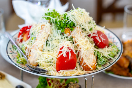 Caesar salad with croutons, cheese, eggs, tomatoes and grilled chicken. Fresh foodの写真素材
