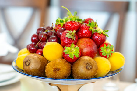 Raw fruits berries assortment platter on the plate, fresh foodの写真素材