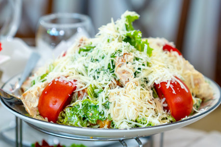 Caesar salad with croutons, cheese, eggs, tomatoes and grilled chicken. Fresh foodの写真素材