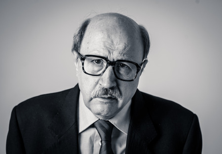 Close up portrait mature bald business man on his 60s feeling sad and worried dementia in Elderly...