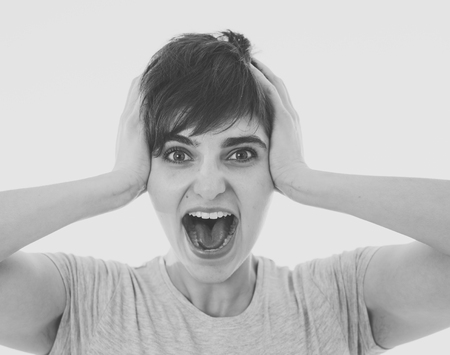 Portrait of beautiful shocked woman wining the lottery or having great success with surprised and...