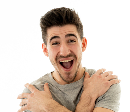Portrait of young man celebrating achievement, a football goal, wining the lottery or having great...