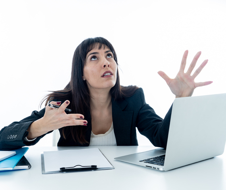 Young beautiful business woman suffering stress working on laptop at office computer desk feeling...