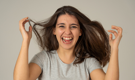 Portrait of beautiful shocked woman hearing good news, winning lottery or having great success with surprised happy face. Making cheerful gestures. Facial Expression, Human Emotions and celebration.の写真素材