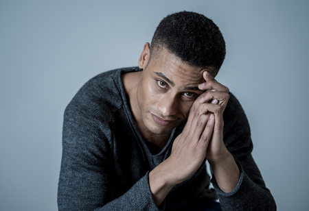 Portrait of young attractive stylish african american man model posing in casual clothes against neutral background looking sexy with beautiful eyes. In People, Beauty and fashion concept.の写真素材