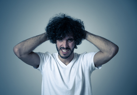 Portrait of young sad man, worried and concerned, looking depressed and desperate. Feeling sorrow...