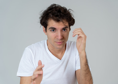 Portrait of Handsome latin young man in shock with a scared expression on his face making frightened...